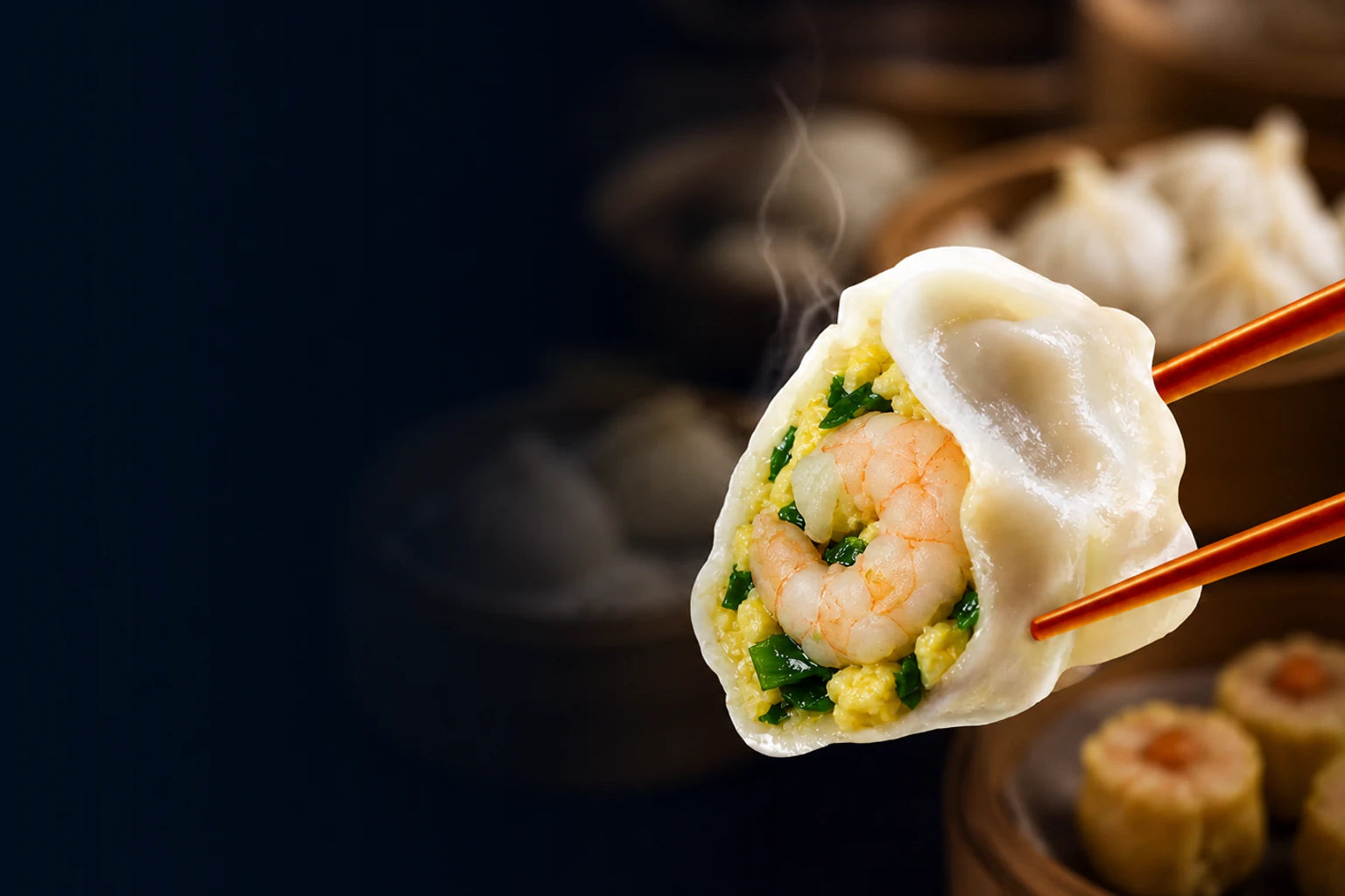 A steaming chive, egg and whole-shrimp dumpling with xiao long bao, shumai and Asian dim sum in the background